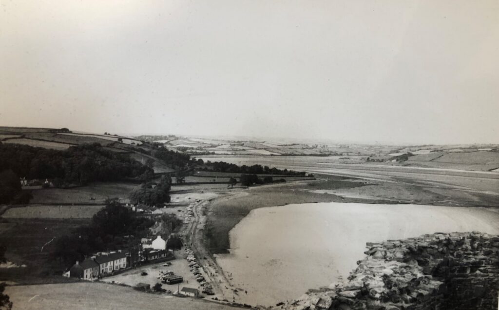 Black and white photograph of  Llansteffan beach from the castle