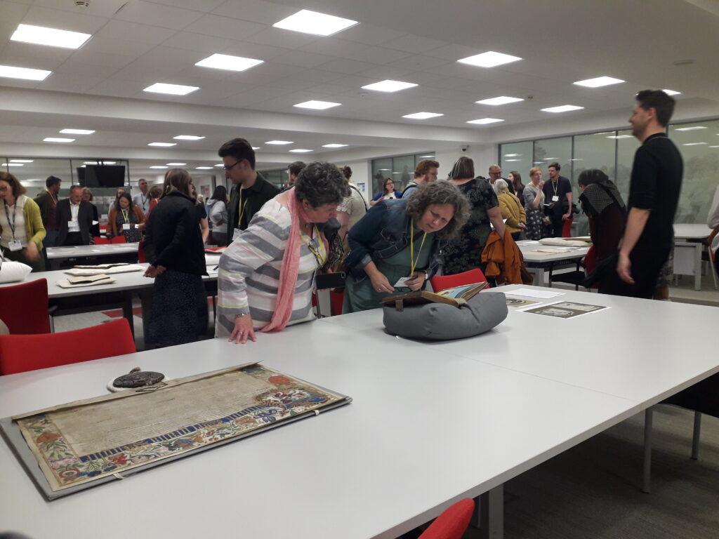 Delegates look at items from the Public Record Office of Northern Ireland’s collection in the reading room.